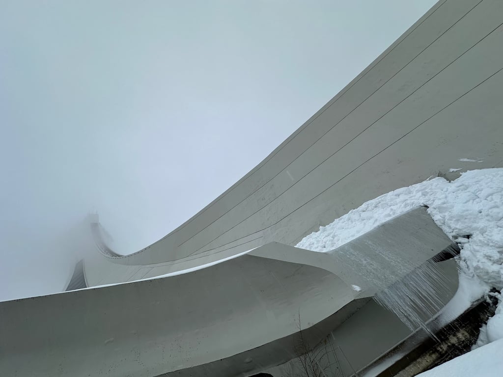 Montreal Tower covered with snow and poking into a cloud