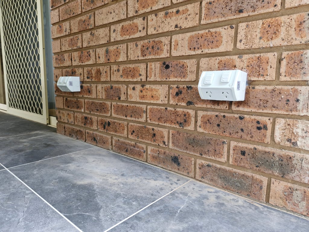 a close up photo of two weatherproof power points