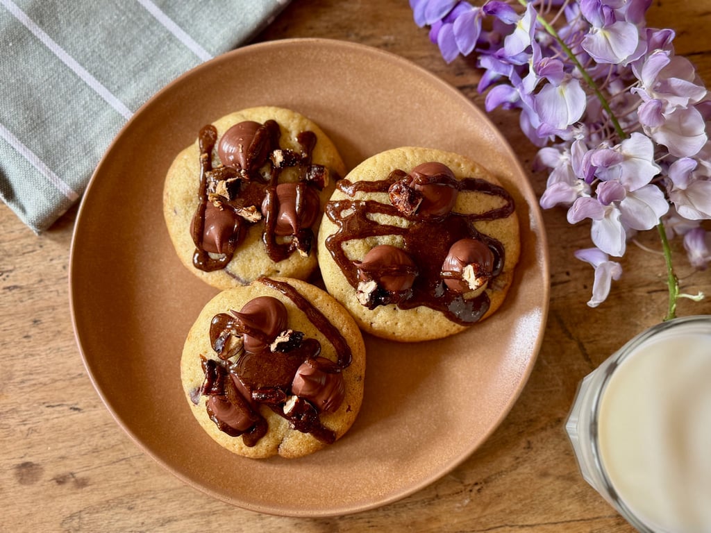 a plate with cookies and milk on a plate