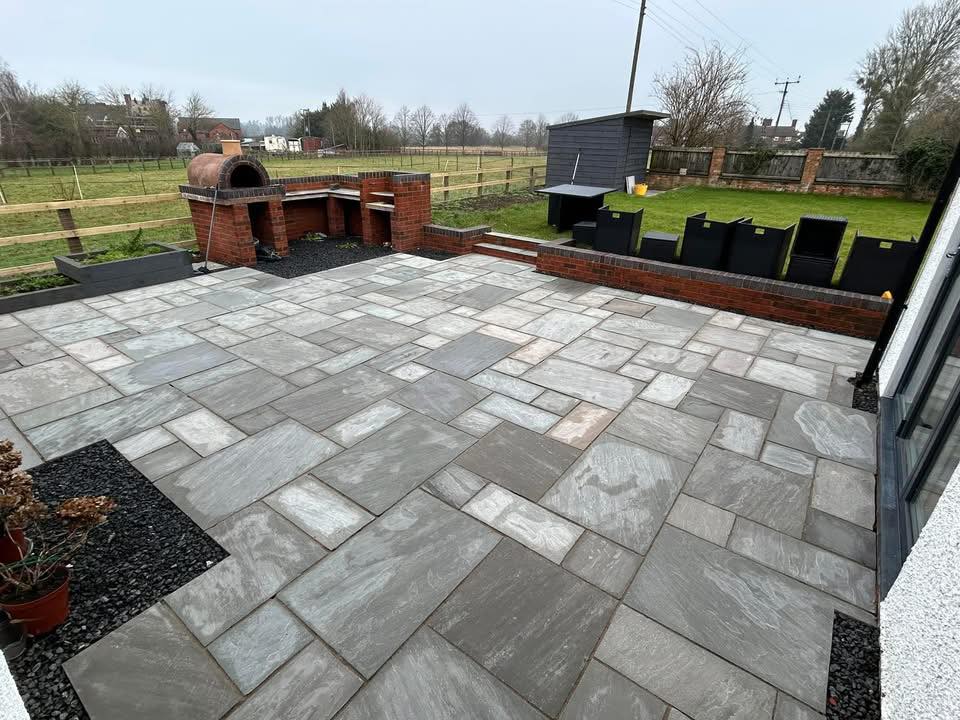 grey garden slabs professionally cleaned by home maintenance experts