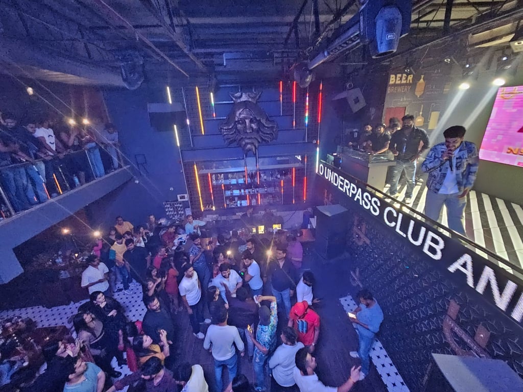 a group of people standing around a stage