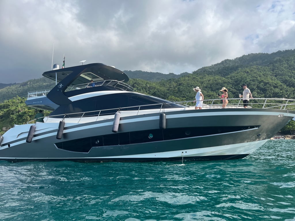 a boat 70 ft with people on it in the water