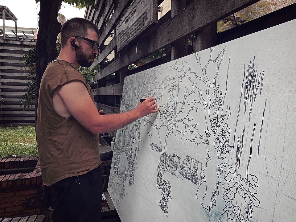 artist Evgeny Bondarenko sketching mural in Taiwan