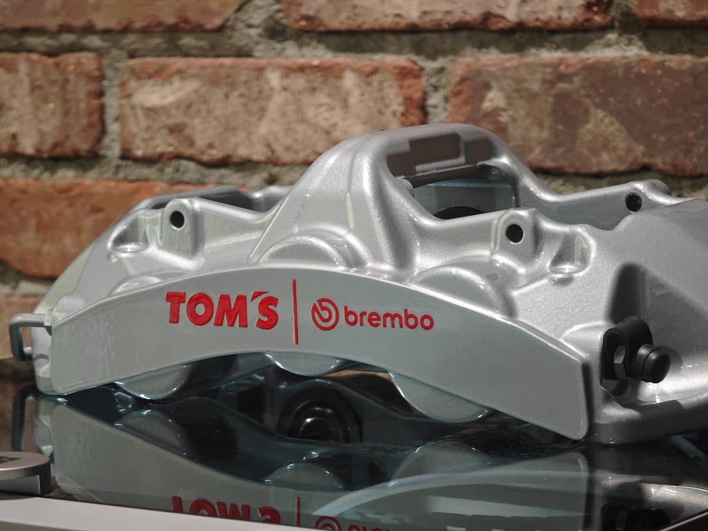 Tom's Brembo GT calipers powder coated in Porsche Silver