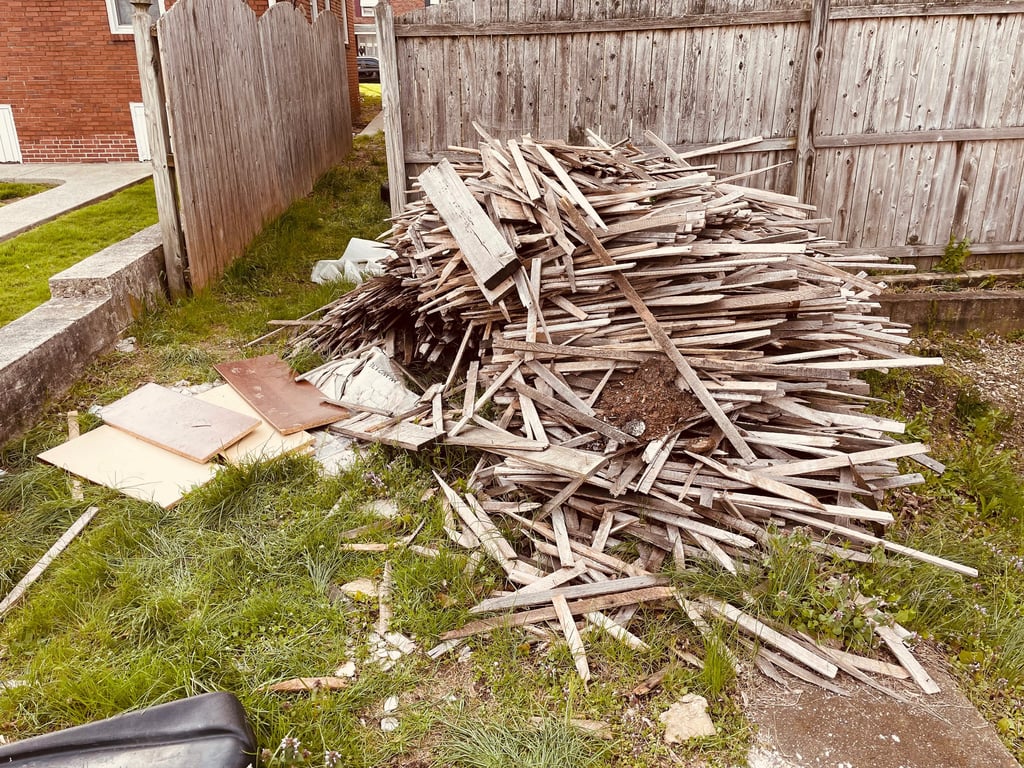Old wooden fence removal and backyard hauling.