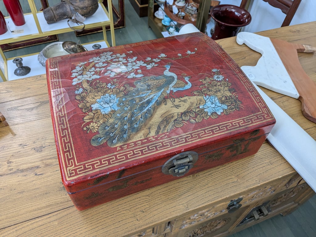a red box with a bird on it (Asian)