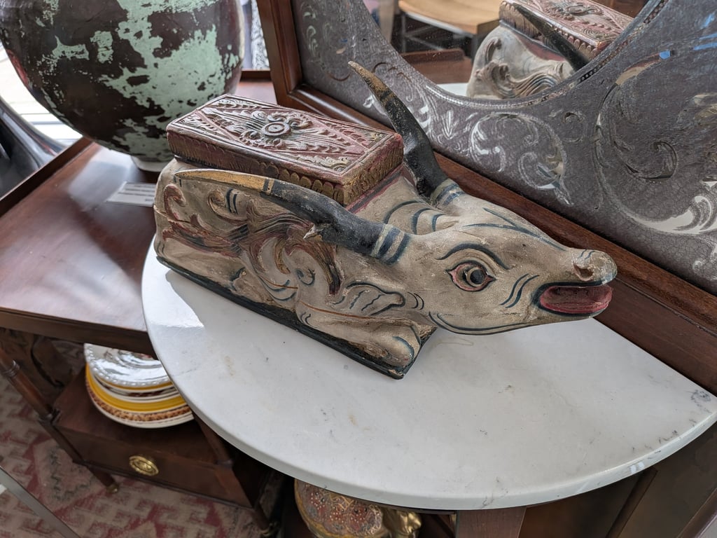 Antique hand-carved wooden water buffalo box.
