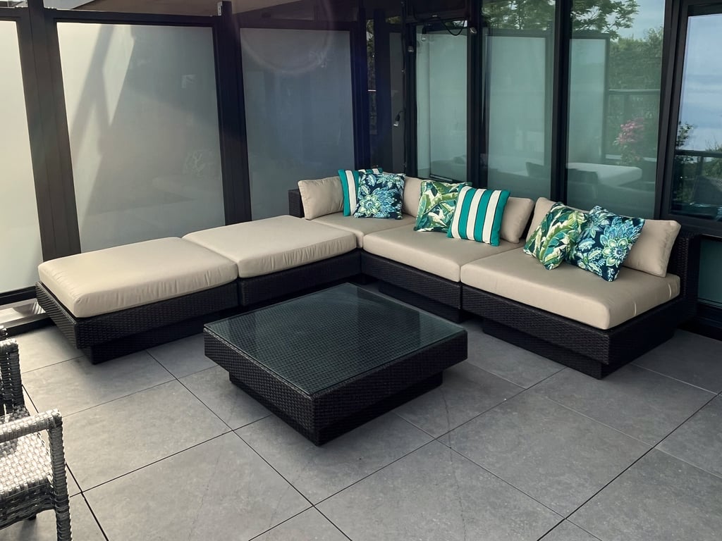 corner view of outdoor patio seating with custom cushions and pillows made in Toronto
