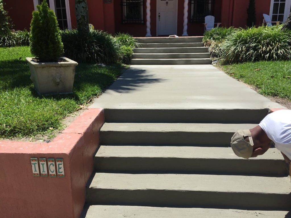 Concrete steps and porch installation in Navarre FL with detailed finishing work