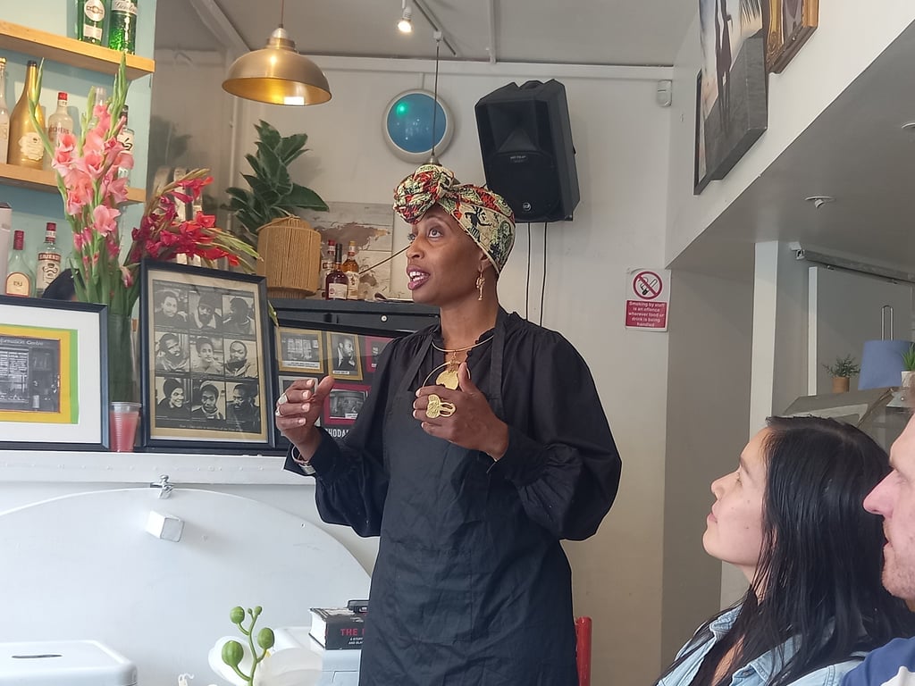 Jamila giving talk about Mangrove Nine