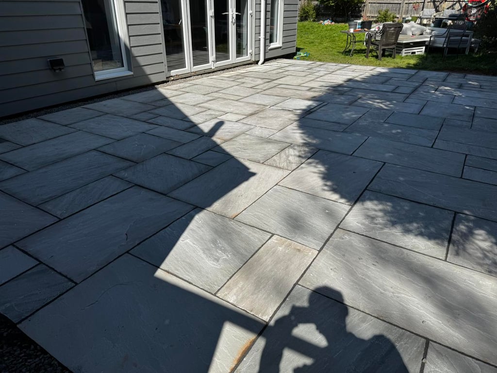 Levelled patio slabs in Worcester garden by B R Building and Landscapes