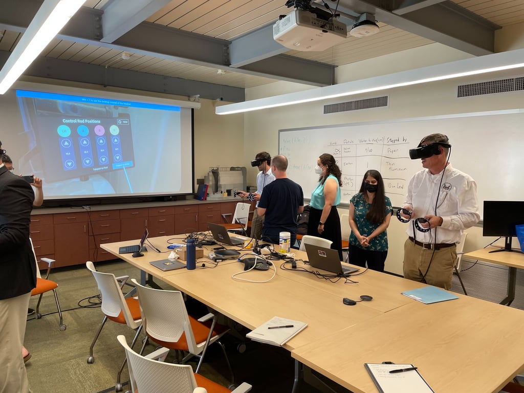 Students wearing VR headsets participate in a virtual reality engineering simulation in a modern classroom.
