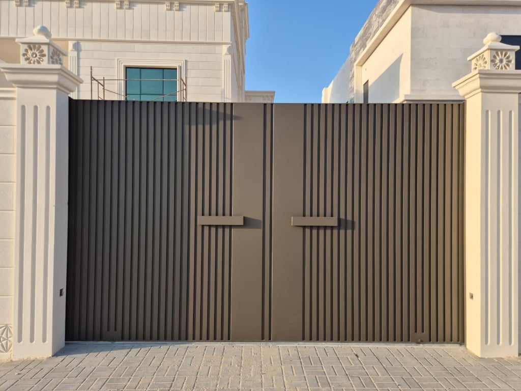 Automatic cast aluminum sliding gate with ornate decorative design for Dubai villa.