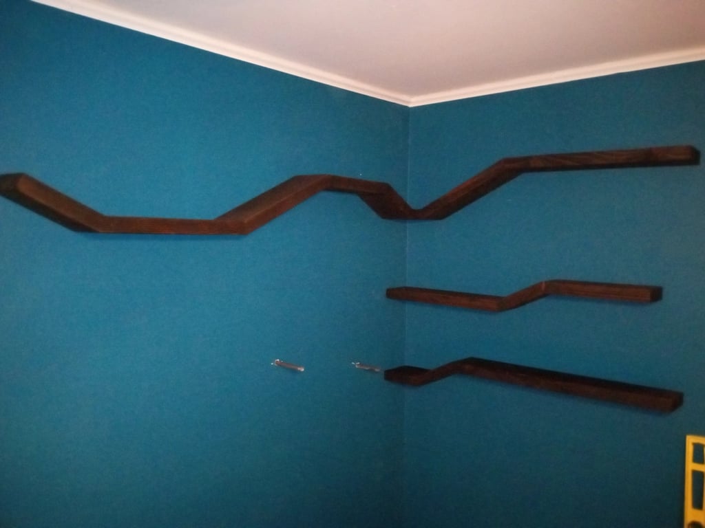 Four floating shelves mounted on wall
