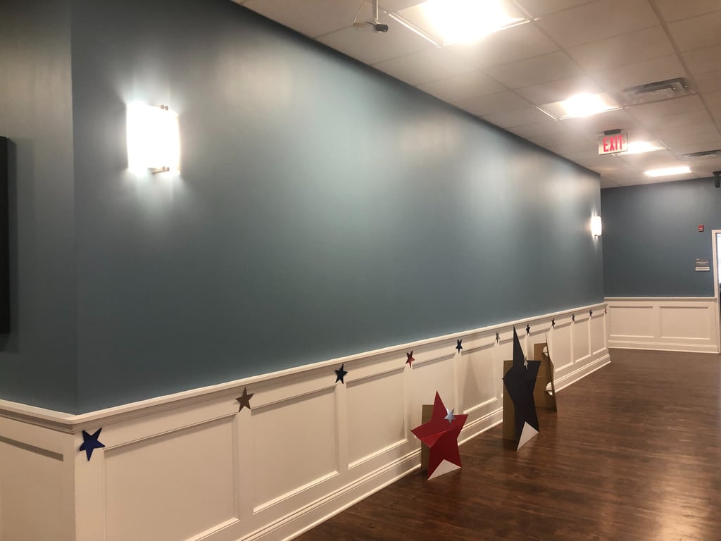 Lobby wall before bespoke mural by Marcine at Mount Bethel Village in Warren, NJ