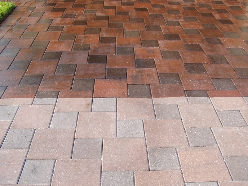 A 50/50 sealed paver area displaying the difference between seal and unsealed pavers