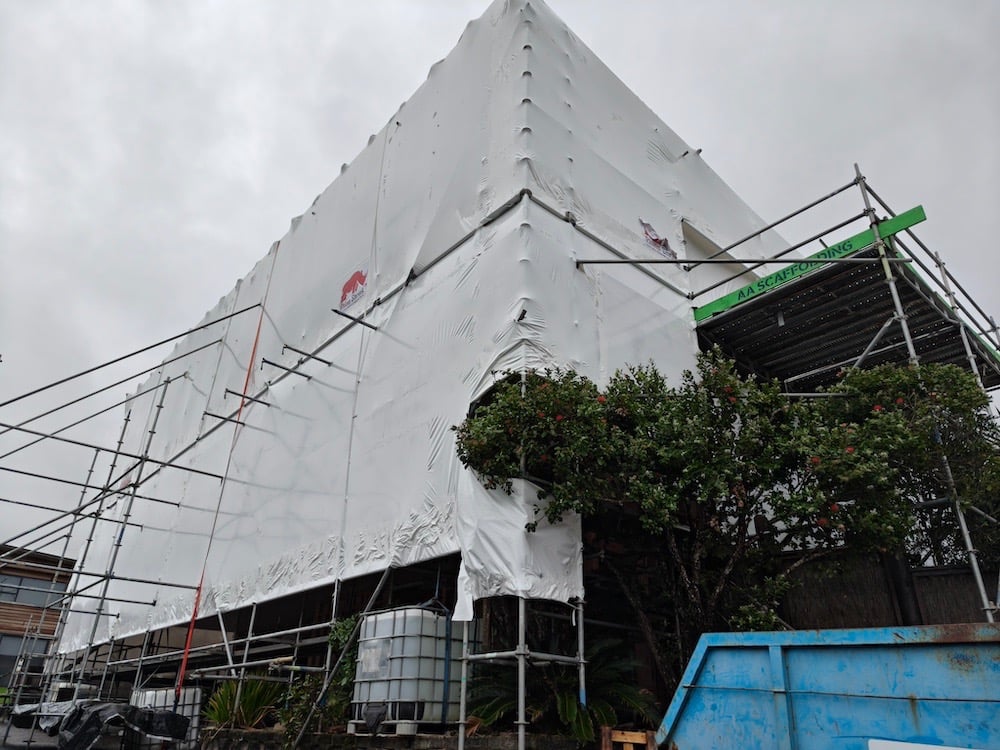 Shrink wrapped home for recladding - CHR Builders