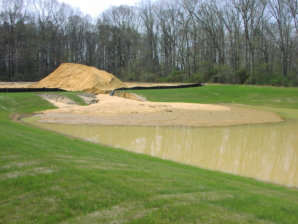 Dirt eroding into a basin.