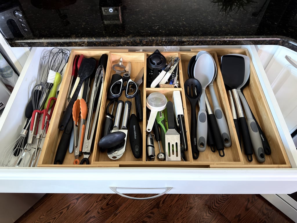 Kitchen drawer organized with a bamboo divider that keeps utensils tidy and easy to find