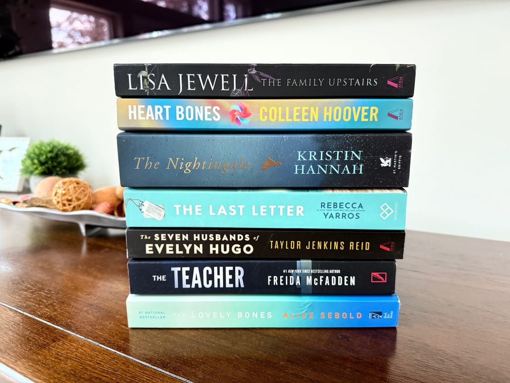 estselling novels stacked on a table for simple book swap inspiration.
