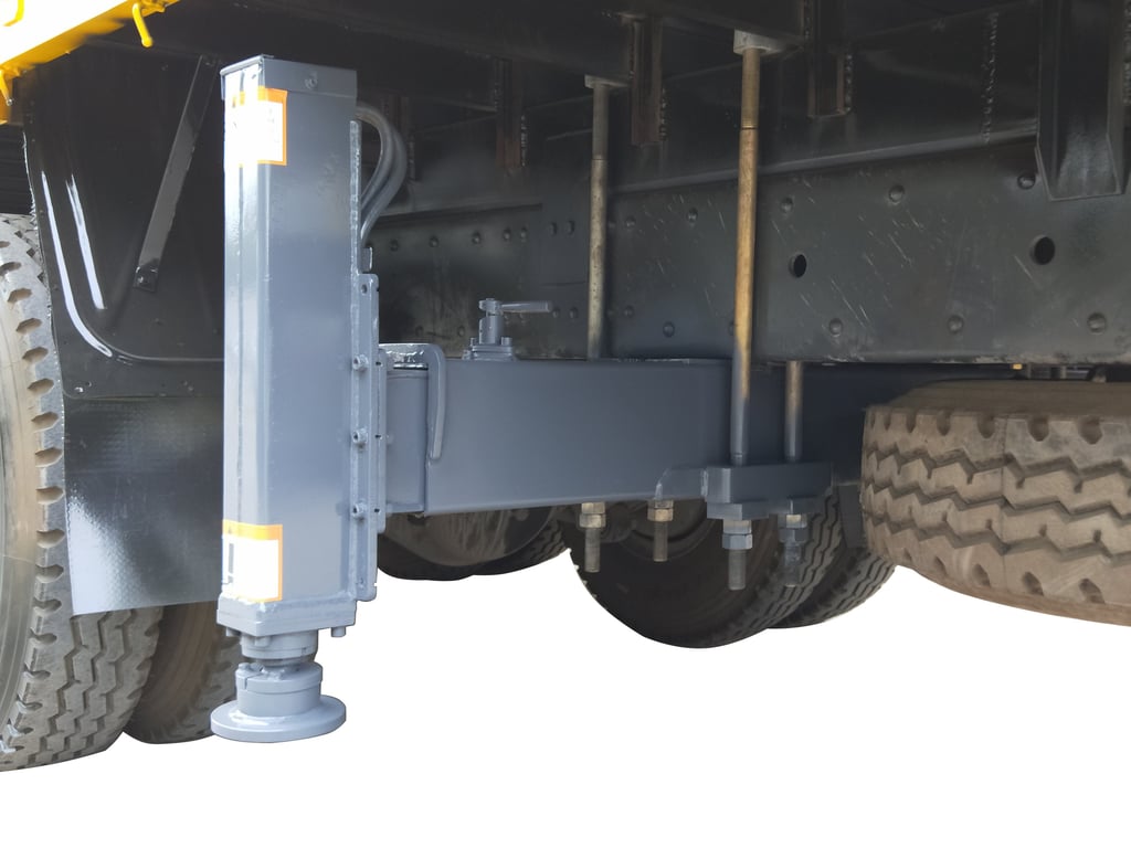 Truck's backside featuring steel plate and rear outriggers for crane support.