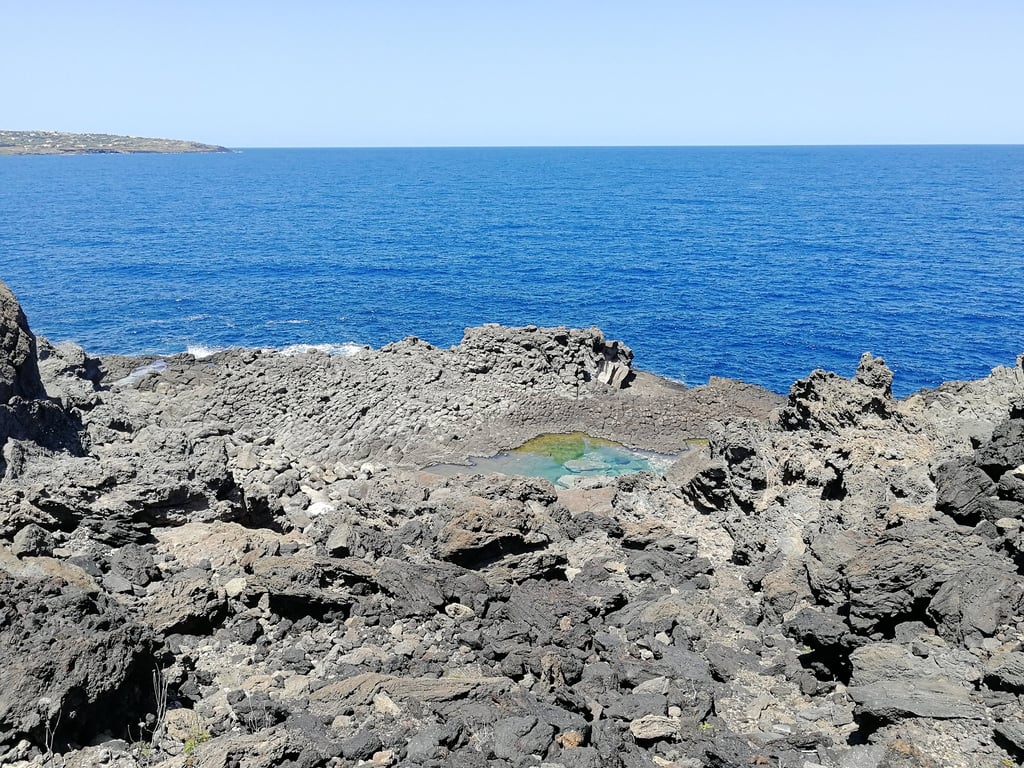 Laghetto delle Ondine in Pantelleria, natural saltwater pool among volcanic rocks and sea