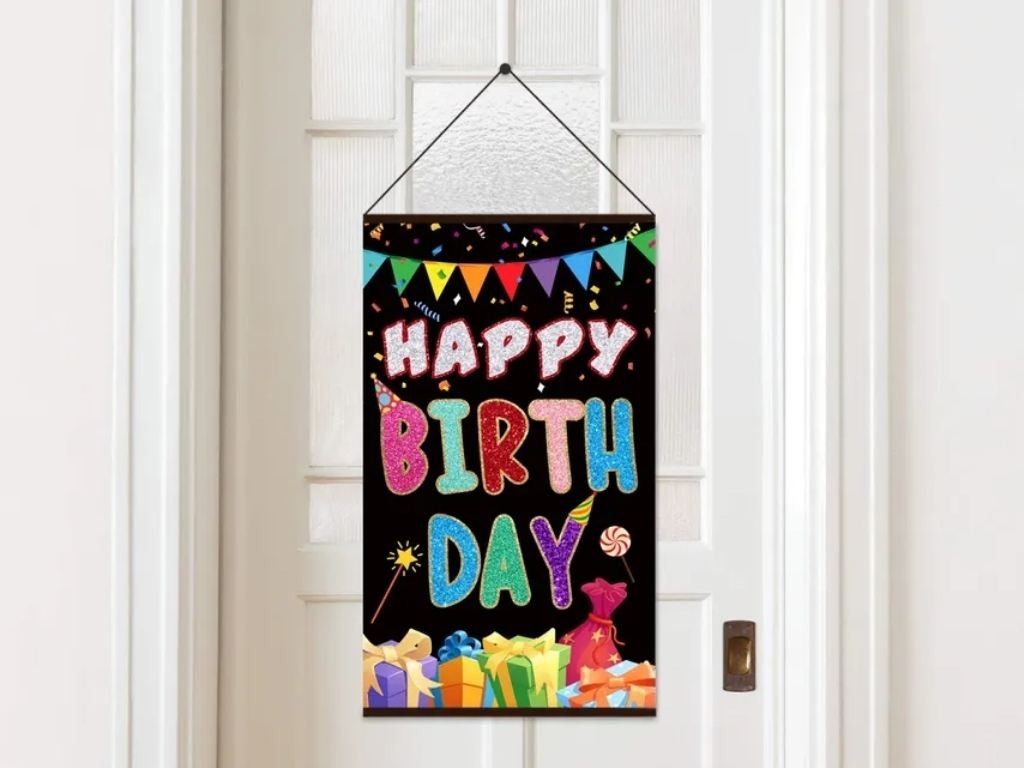 happy birthday sign in a sintra board hanging in door