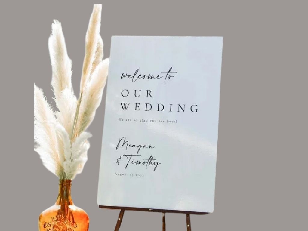 Maegan and timothy. white wedding sign