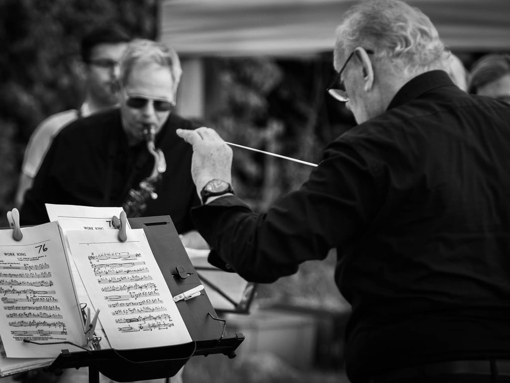  A black and white portrait of a conductor during the concert in the open air in Duxford. Author: Slawek Dejneka