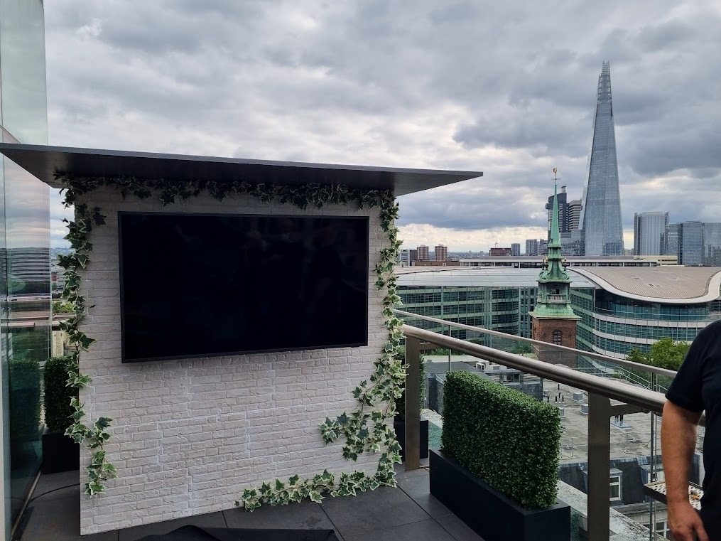 Professional installation of a Samsung Terrace outdoor TV on a luxury balcony overlooking the London