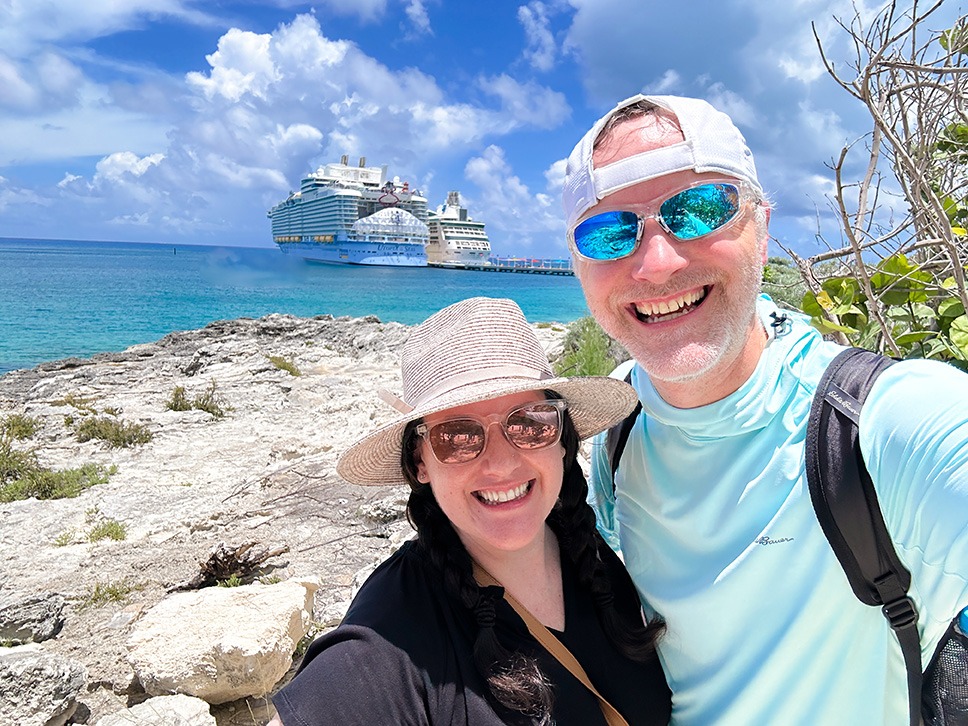 Minnie's Travel Boutique owners Chris and Kristen Breedlove pictured in front of Utopia of the Seas.