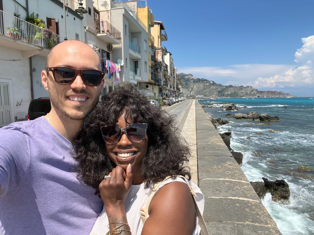 a man and woman taking a selfie with a camera