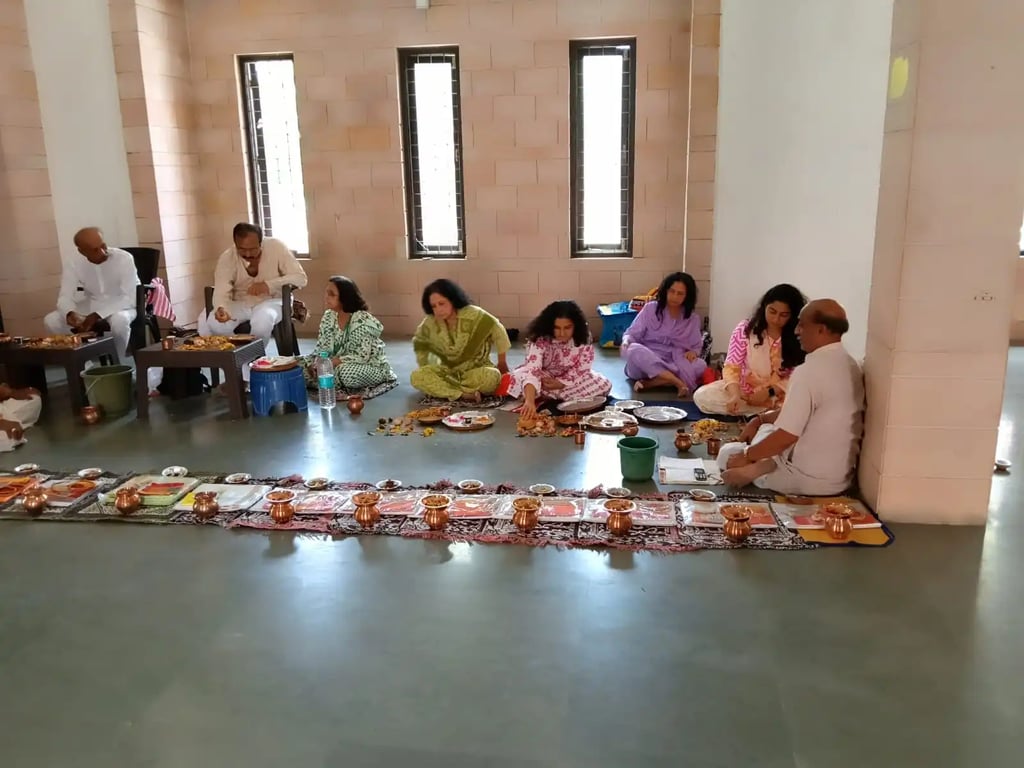 Extended Hindu family performing Matrugaya Shraddh Pooja with copper kalash arrangement at Bindu Sarovar Siddhpur