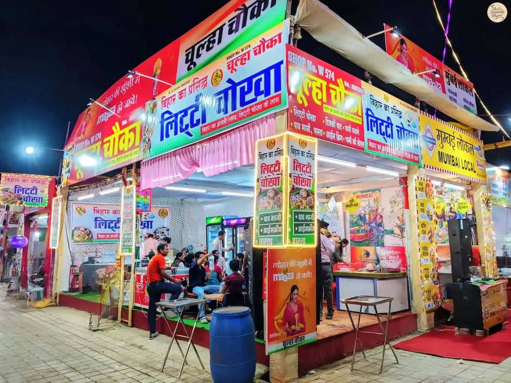 Stalls serving diverse culinary delights from different Indian states at Kota Dussehra Mela.