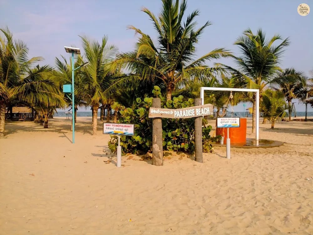 Paradise Beach Pondicherry with golden sand and calm blue waves.