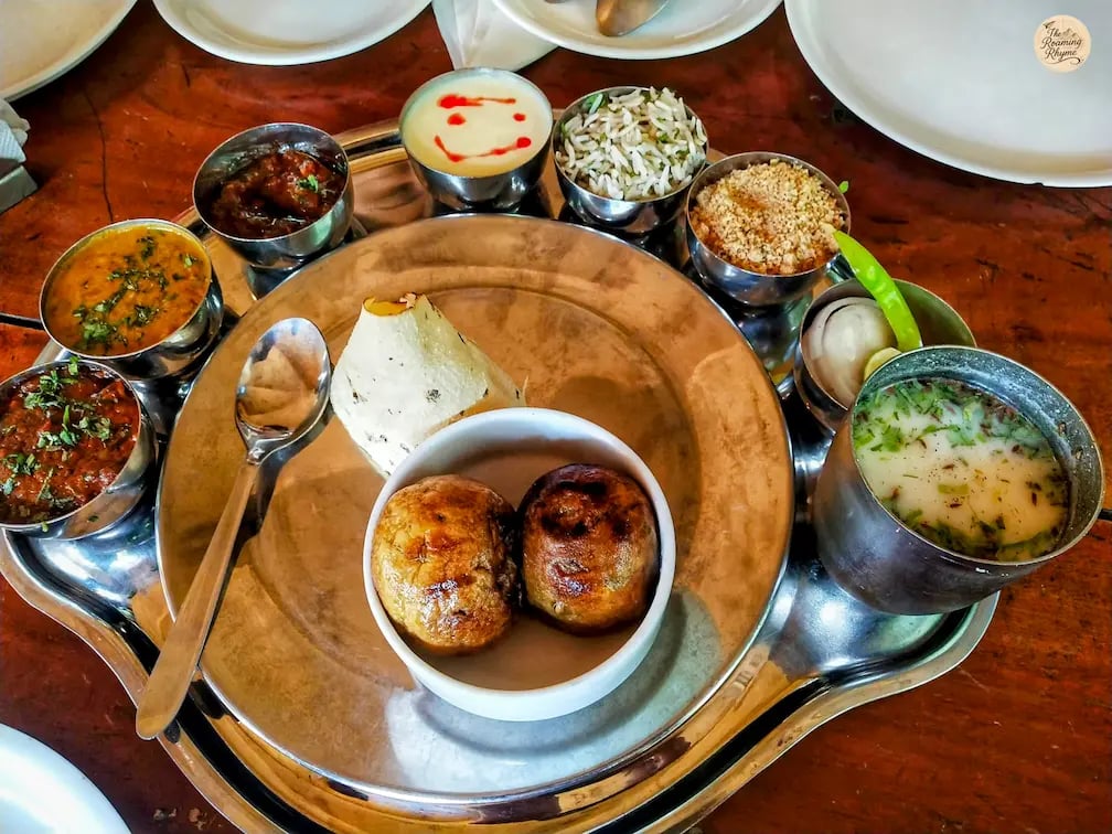 Traditional Rajasthani thali with dal baati churma, gatte ki sabzi, and other dishes