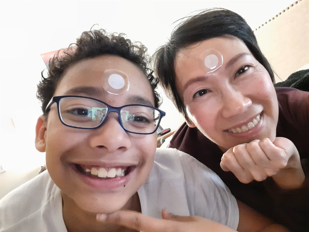 Denise and son with patches on face