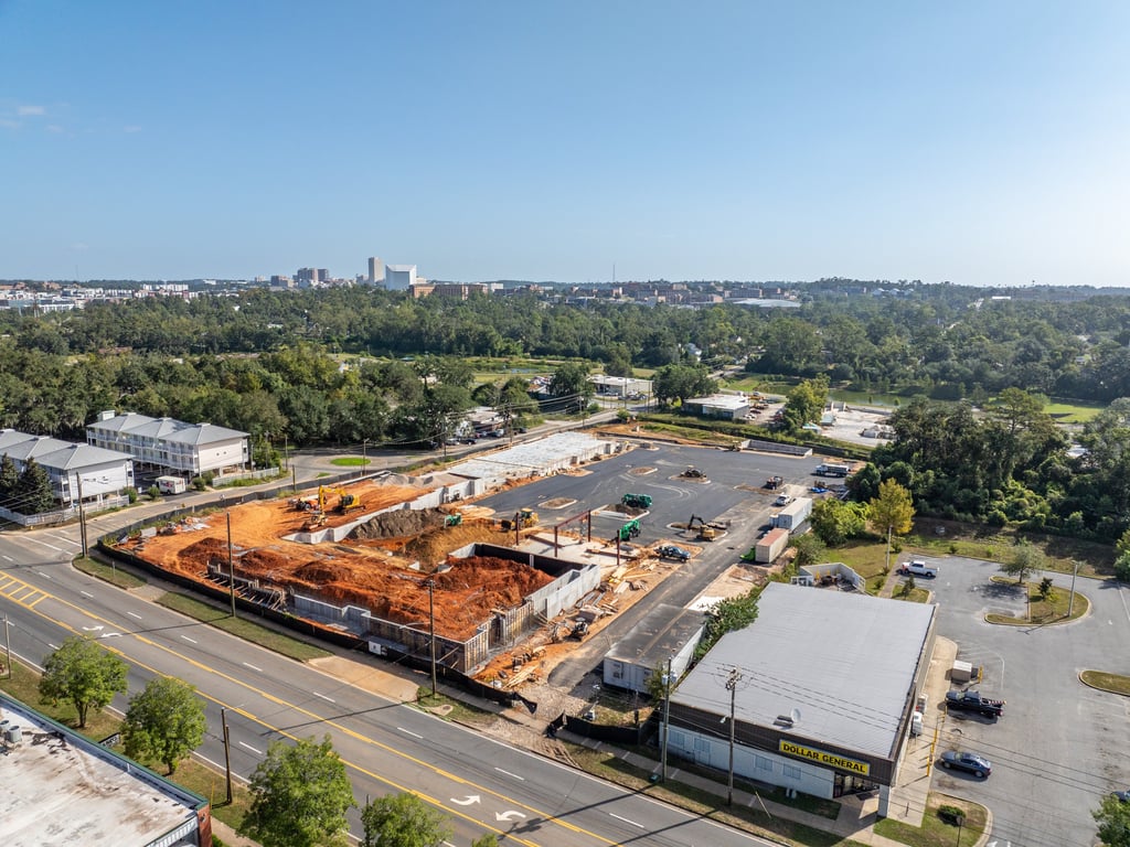 a large building with a lot of construction materials and a lot of construction equipment