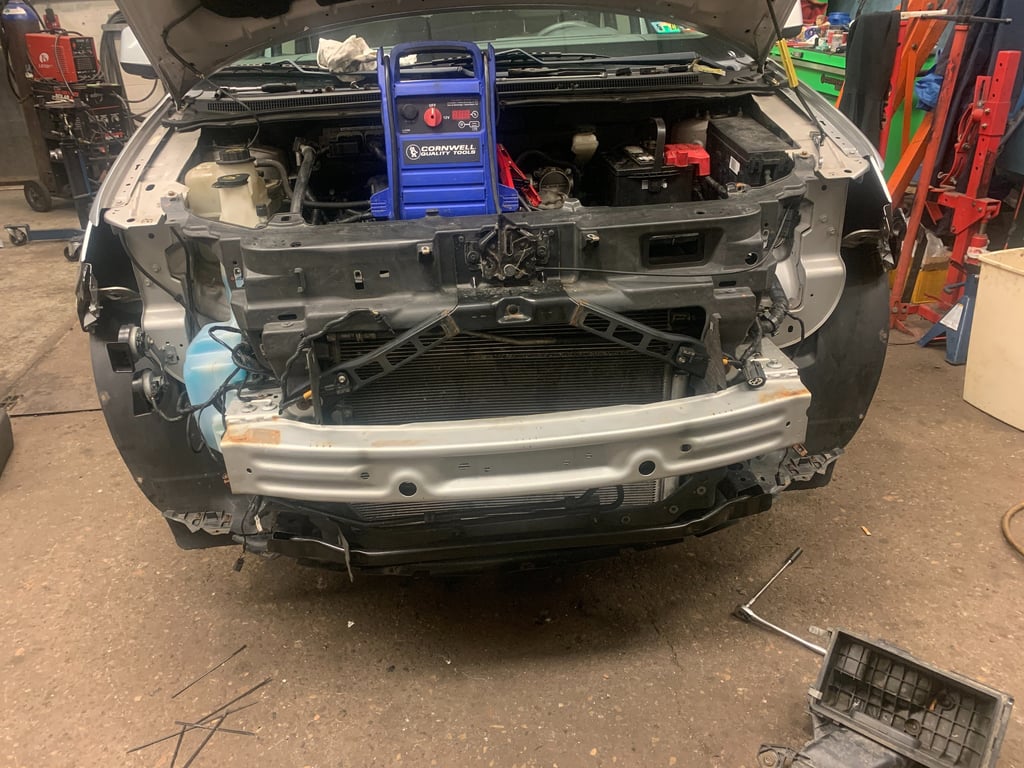 Suv Had bumper removed for headlight services. Battery is being charged