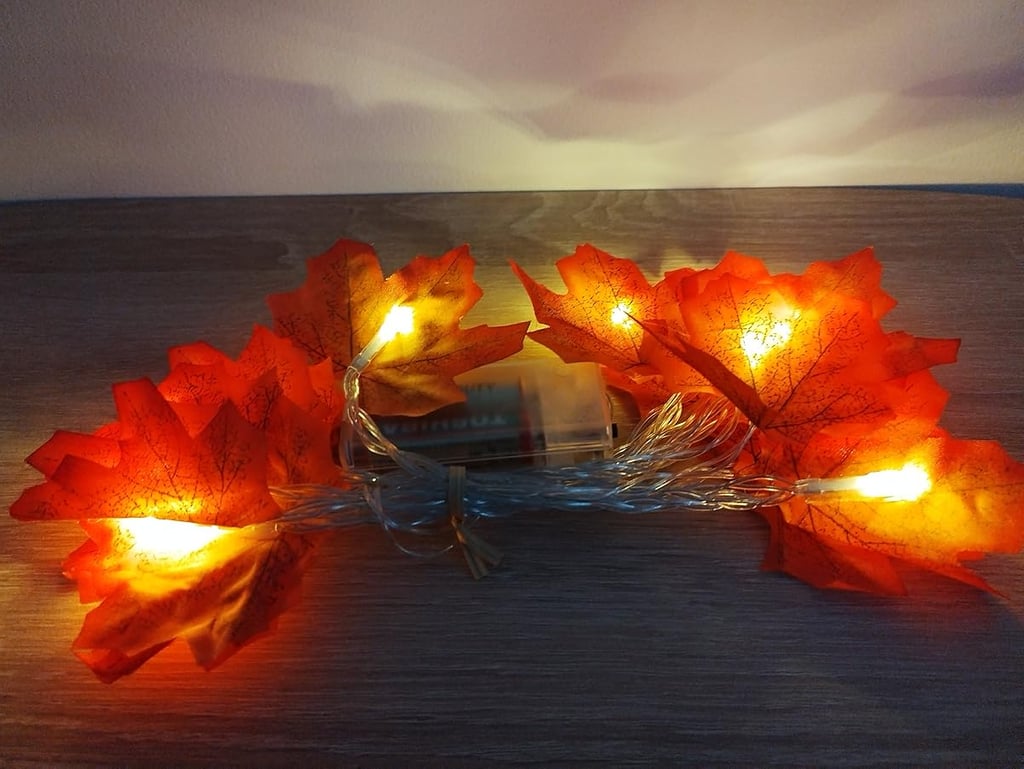 Battery-operated maple leaf string lights with 20 warm orange LEDs on a 9.8ft copper wire,