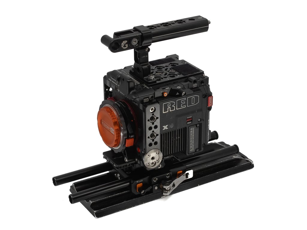 Professional RED V-Raptor digital cinema camera rig with top handle and baseplate on a white background.