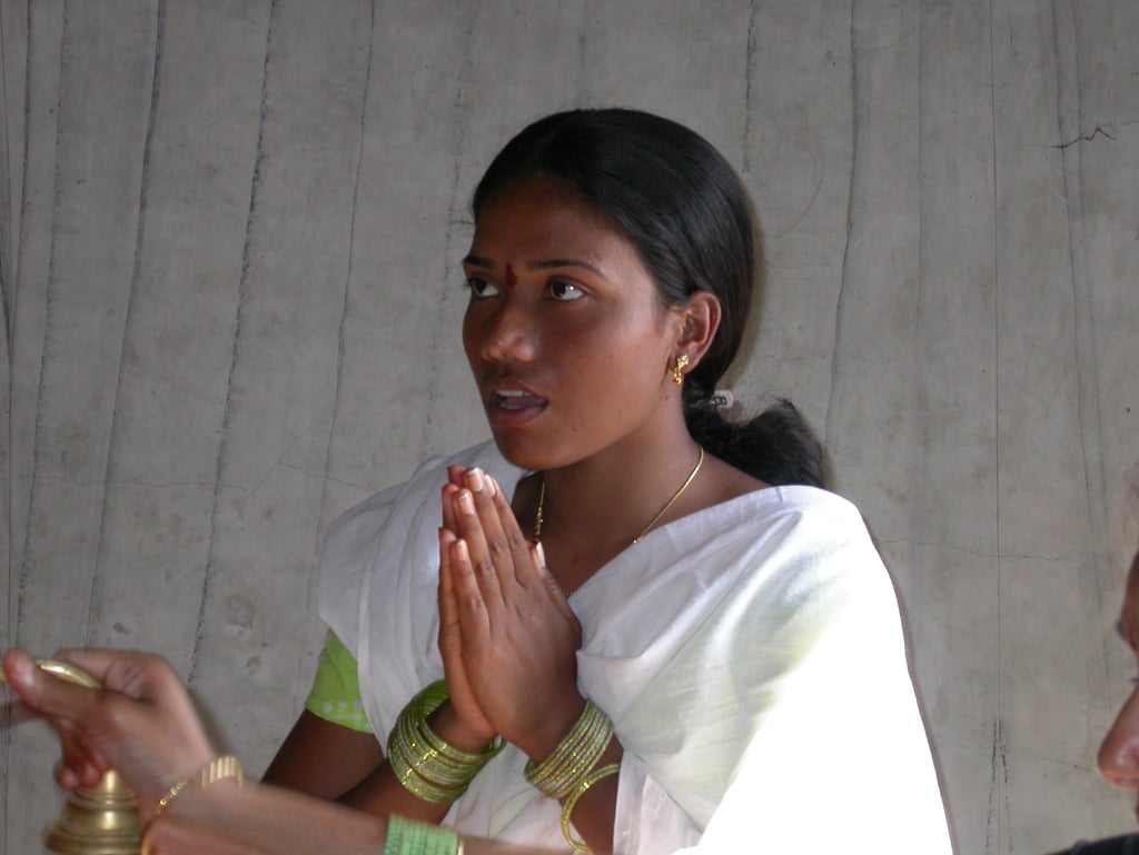 Indian Girl praying to the Goddess