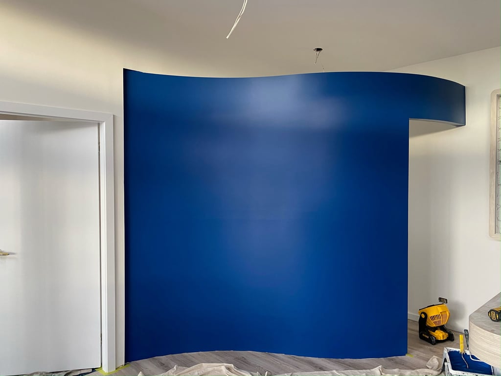 a room with a blue wall and a white door featrue wall 