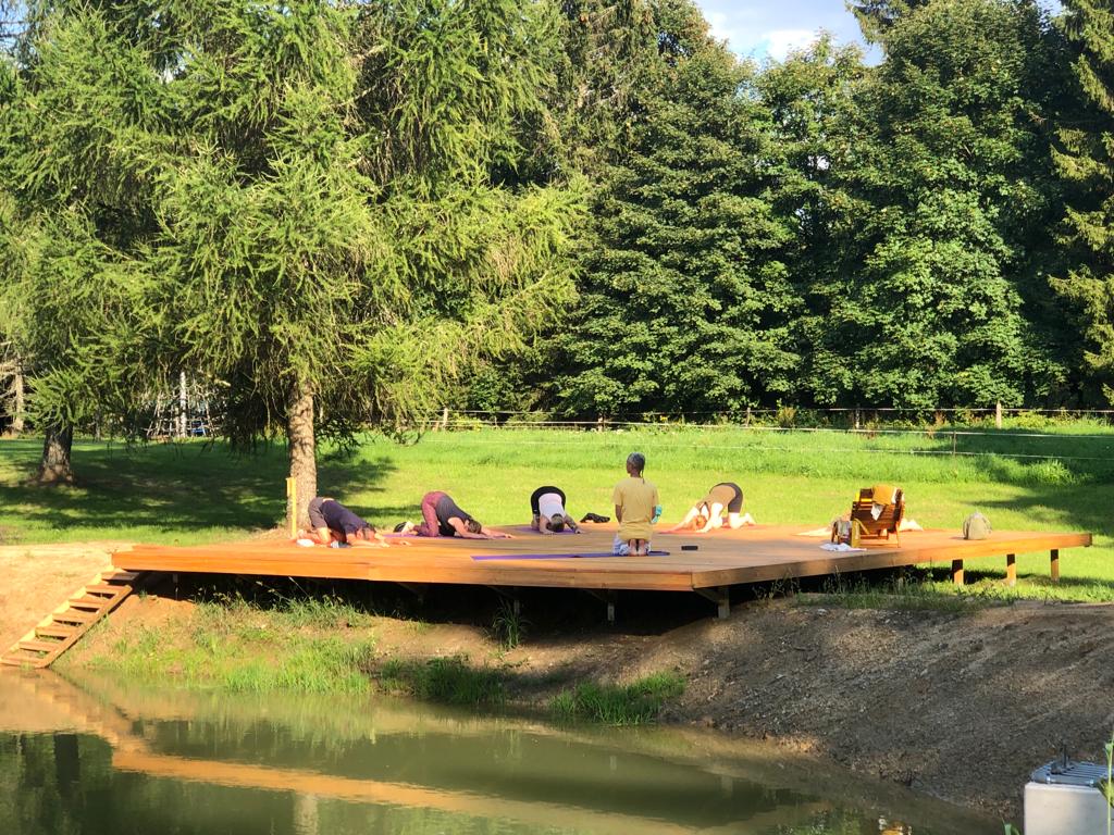 yoga outdoors in garden with sun at yoga retreat