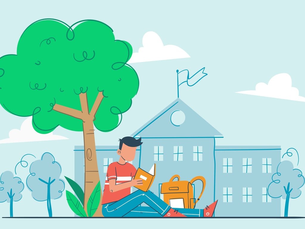 A Cambridge Maths students under a tree infront of a school