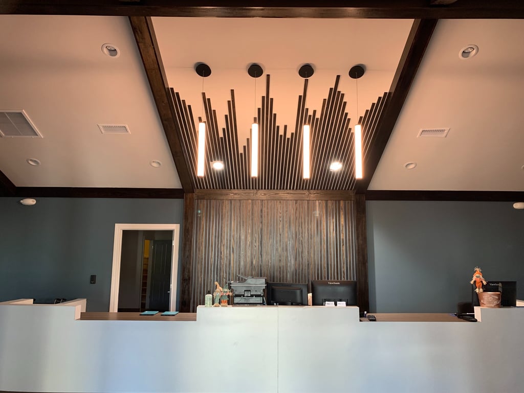 a picture of commercial construction showing a reception desk with a large wooden reception table
