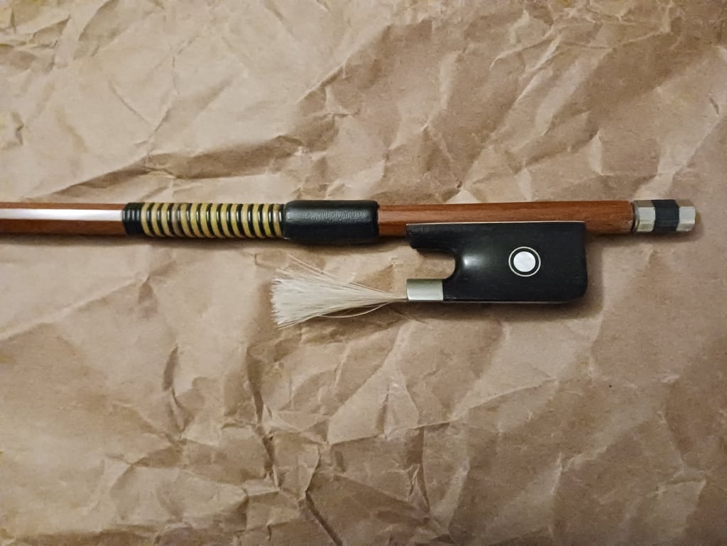 Cello bow with an imitation whalebone winding and a black goatskin grip