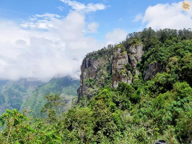 Pillar Rocks standing tall with the scenic valley in the background.