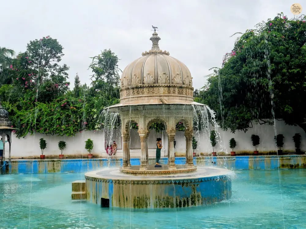Fountain courtyard surrounded by greenery at the royal Saheliyon ki Bari in Udaipur Rajasthan