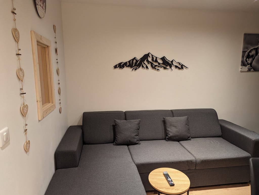 Cozy lounge area inside a modern mountain apartment in Val Thorens with warm alpine atmosphere